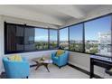 Bright sunroom featuring floor-to-ceiling windows with city and mountain views at 3131 E Alameda Ave # 1003, Denver, CO 80209