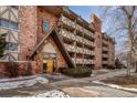 Attractive brick condo building with a unique entrance and balcony details at 1243 Gaylord St # 410, Denver, CO 80206