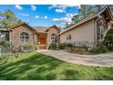 House with stone accents and landscaping, welcoming front entrance at 8174 Inca Rd, Larkspur, CO 80118