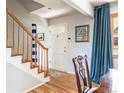 Welcoming entryway with hardwood floors, staircase, and a bright, airy feel at 5915 S Race St, Greenwood Village, CO 80121