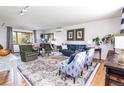 Spacious living room with a large window, hardwood floors, and stylish decor at 5915 S Race St, Greenwood Village, CO 80121
