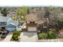 Aerial view of a two-story home with a large front yard, showcasing its location within a quiet residential neighborhood at 9911 Perry Ct, Westminster, CO 80031