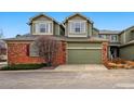 Charming townhouse showcasing a well-kept yard, two-car garage and brick accents at 3548 W 126Th Pl, Broomfield, CO 80020