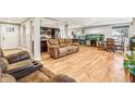 Inviting living room with hardwood floors, neutral paint, and an aquarium for a calming effect at 14290 W 54Th Ave, Arvada, CO 80002