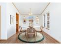 Cozy dining room with a round table, chandelier, and natural light at 2019 S Fox St, Denver, CO 80223