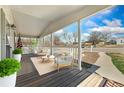 Inviting front porch features comfortable seating and a charming view of the neighborhood at 2019 S Fox St, Denver, CO 80223