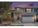 Charming two-story home with stone accents, well-maintained landscaping, and an attached two-car garage at 23841 E Alabama Dr, Aurora, CO 80018