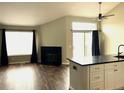 Spacious living room has a fireplace, lots of light from the large window, and access to the patio at 1470 S Quebec Way # 275, Denver, CO 80231