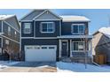Beautiful home with stone accents, neutral paint, a covered front porch, an attached two-car garage, and well maintained landscaping at 17412 Rose Mallow St, Parker, CO 80134