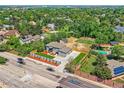 Spacious home with landscaped yard, pool, tennis court, and lush greenery at 10197 E Mississippi Ave, Denver, CO 80247