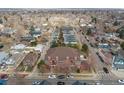Birds eye view of an apartment building with a brown roof, surrounded by streets and other residential buildings at 4001 W 32Nd Ave # 1, Denver, CO 80212