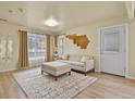 Bright living room with hardwood floors and neutral decor at 21422 E 47Th Ave, Denver, CO 80249