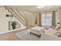 Inviting living room with staircase and stylish furnishings at 21422 E 47Th Ave, Denver, CO 80249
