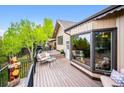 Enjoy the back deck with mountain views, outdoor seating and access to the home at 11094 Thomas Dr, Conifer, CO 80433