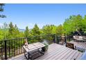 Spend time relaxing on the deck with views of the forested mountain landscape at 11094 Thomas Dr, Conifer, CO 80433