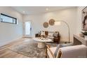 Bright and airy living room with hardwood floors and modern furniture at 1717 Grove St, Denver, CO 80204