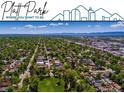 Breathtaking aerial view of Platt Park's lush tree-lined streets and charming homes under a bright blue sky at 485 E Arizona Ave, Denver, CO 80210