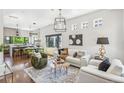Bright and open living room with hardwood floors and stylish furnishings, perfect for modern living at 485 E Arizona Ave, Denver, CO 80210