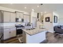 Modern kitchen featuring granite countertops, stainless steel appliances, and stylish cabinetry at 7022 Todd Ct, Frederick, CO 80530