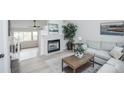 Bright living room featuring a modern fireplace and stylish furniture at 329 Lodgewood Ln, Lafayette, CO 80026