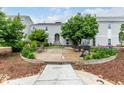 Charming outdoor patio with seating, barbecue grill, and beautiful landscaping for relaxing and entertaining at 11105 E Alameda Ave # 204, Aurora, CO 80012