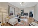 Comfortable living room showcasing an area rug, neutral paint, and natural light at 2819 W 43Rd Ave, Denver, CO 80211