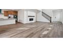 Bright, open-concept living space featuring hardwood floors and contemporary finishes at 9257 Truckee Ct, Commerce City, CO 80022