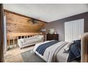 Cozy bedroom features a wooden ceiling and hardwood floors at 2694 S Xanadu Way # D, Aurora, CO 80014