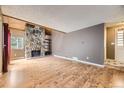 The living room has a stone fireplace, wood accents, and great natural light at 2694 S Xanadu Way # D, Aurora, CO 80014