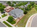 Spacious home with a fenced backyard, lush greenery, and a neatly manicured lawn at 16120 E 119Th Ave, Commerce City, CO 80022