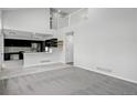 Open-concept layout showcasing the living room and kitchen with modern finishes at 1874 Cedaridge Cir, Superior, CO 80027
