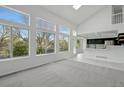 Sun-filled living room featuring soaring ceilings and large windows that provide natural light at 1874 Cedaridge Cir, Superior, CO 80027