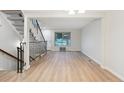 Bright, open living room with hardwood floors and staircase at 12927 W 20Th Ave, Golden, CO 80401