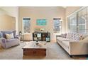 Cozy living room with comfortable seating, natural light, and a welcoming atmosphere at 12710 W 84Th Cir, Arvada, CO 80005