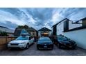 Gravel parking area with space for three cars in the backyard at 3443 Lawrence St, Denver, CO 80205