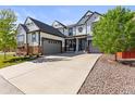 Beautiful home boasting a spacious driveway, two-car garage, and charming curb appeal at 14920 Munich Ave, Parker, CO 80134