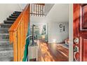 Spacious entryway flowing to the living room with hardwood floors and a staircase, creating an inviting atmosphere at 1907 S Helena St # G, Aurora, CO 80013