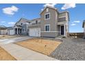 Charming two-story home with gray siding and a well-manicured yard at 5718 Ranch St, Mead, CO 80504