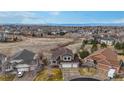 Wide aerial view showcasing a home with an attached three-car garage located in a suburban neighborhood at 22630 E Ida Cir, Aurora, CO 80015