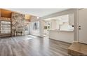 Inviting living room features hardwood floors and a stunning stone fireplace at 2453 S Xanadu Way # C, Aurora, CO 80014
