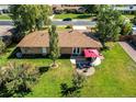 House with backyard patio, firepit, and spacious grassy yard at 867 S Everett St, Lakewood, CO 80226