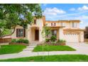 Inviting two-story home boasting a lush green lawn and a cozy front porch at 16650 E 107Th Ct, Commerce City, CO 80022