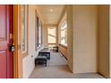 Covered front porch with space for seating to enjoy the neighborhood views at 16650 E 107Th Ct, Commerce City, CO 80022