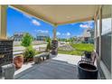Charming front porch with a seating area offers relaxing views of the neighborhood at 20503 E 50Th Pl, Denver, CO 80249