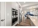Stainless steel appliances in the kitchen complement the wood flooring and open floor plan at 20503 E 50Th Pl, Denver, CO 80249