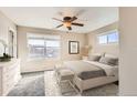 Spacious main bedroom with a ceiling fan and ample natural light at 164 Bristlecone St, Brighton, CO 80601