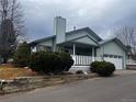Charming one-story home with front porch and landscaping at 19 Carla Way, Broomfield, CO 80020