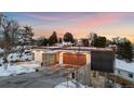 Modern home with a stunning architectural design, featuring a flat roof and sleek facade at 2206 Alpine Dr, Boulder, CO 80304