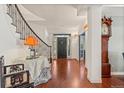 Bright entryway featuring hardwood floors, grand staircase, and elegant decor at 344 Saint Paul St, Denver, CO 80206