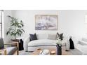 Bright living room showcasing modern decor, stylish furnishings, and a calming color palette at 8787 Yukon St, Arvada, CO 80005
